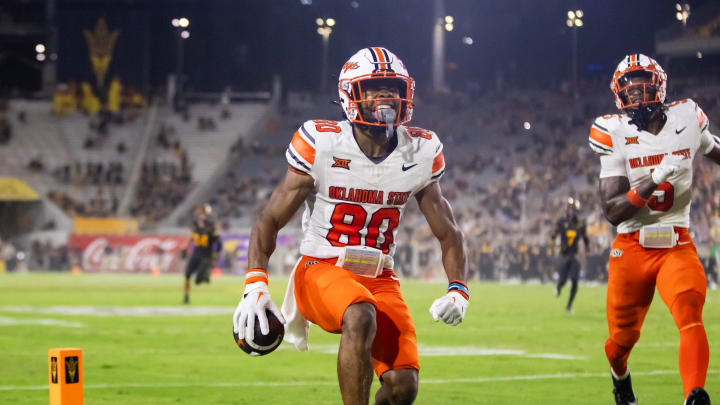 Sep 9, 2023; Tempe, Arizona, USA; Oklahoma State Cowboys wide receiver Brennan Presley (80) celebrates after scoring a touchdown against the Arizona State Sun Devils in the second half at Mountain America Stadium. Mandatory Credit: Mark J. Rebilas-USA TODAY Sports