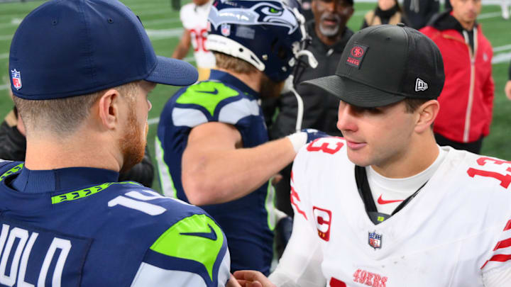 Seattle Seahawks quarterback Sam Darnold (14) and San Francisco 49ers quarterback Brock Purdy 