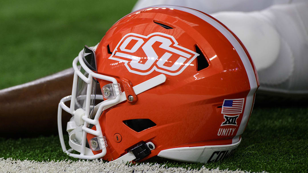 Dec 4, 2021; Arlington, TX, USA; A view of an Oklahoma State Cowboys helmet and logo as the Cowboys warm up before the game against the Baylor Bears during the Big 12 Conference championship game at AT&T Stadium. Mandatory Credit: Jerome Miron-Imagn Images