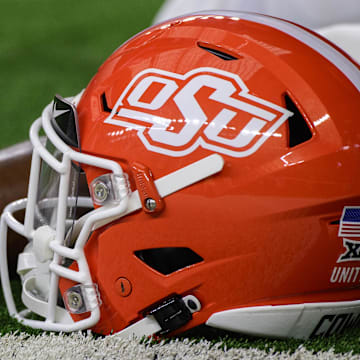 Dec 4, 2021; Arlington, TX, USA; A view of an Oklahoma State Cowboys helmet and logo as the Cowboys warm up before the game against the Baylor Bears during the Big 12 Conference championship game at AT&T Stadium. Mandatory Credit: Jerome Miron-Imagn Images
