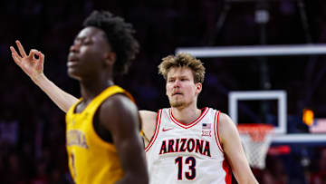 Mar 4, 2025; Tucson, Arizona, USA; Arizona Wildcats forward Henri Veesaar (13) holds up a three after he makes a three-point basket over Arizona State Sun Devils guard Joson Sanon (3) during the second half at McKale Center. Mandatory Credit: Aryanna Frank-Imagn Images