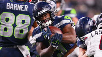 Oct 20, 2025; Seattle, Washington, USA; Seattle Seahawks running back Kenneth Walker III (9) runs the ball during the third quarter against the Houston Texans at Lumen Field. Mandatory Credit: Steven Bisig-Imagn Images