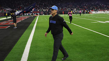 Jan 11, 2025; Houston, Texas, USA; Los Angeles Chargers head coach Jim Harbaugh walks off after losing to Houston Texans in an AFC wild card game at NRG Stadium. Mandatory Credit: Thomas Shea-Imagn Images