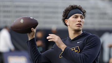 Sep 19, 2024; Boone, North Carolina, USA;  Appalachian State Mountaineers quarterback Joey Aguilar (4) throws a warmup pass before the game against the South Alabama Jaguars at Kidd Brewer Stadium. Mandatory Credit: Reinhold Matay-Imagn Images