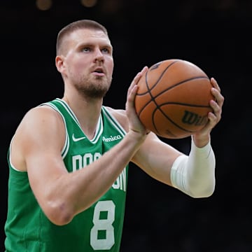 May 7, 2025; Boston, Massachusetts, USA; Boston Celtics center Kristaps Porzingis (8) shoots a free throw against the New York Knicks in the second half during game two of the second round for the 2025 NBA Playoffs at TD Garden. Mandatory Credit: David Butler II-Imagn Images