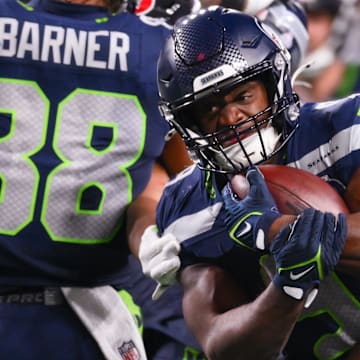 Oct 20, 2025; Seattle, Washington, USA; Seattle Seahawks running back Kenneth Walker III (9) runs the ball during the third quarter against the Houston Texans at Lumen Field. Mandatory Credit: Steven Bisig-Imagn Images