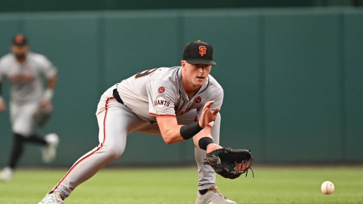 Aug 6, 2024; Washington, District of Columbia, USA; San Francisco Giants short stop Tyler Fitzgerald (49) fields a ground ball against the Washington Nationals during the first inning at Nationals Park. 