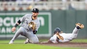 Apr 23, 2025; Minneapolis, Minnesota, USA; The throw to Chicago White Sox shortstop Jacob Amaya (8) is late as Minnesota Twins second base Luke Keaschall (15) slides safe into second base in the third inning at Target Field. Mandatory Credit: Matt Blewett-Imagn Images