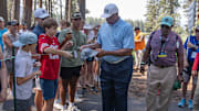 Former NBA star Charles Barkley signs autographs for fans during the American Century Celebrity Championship golf tournament