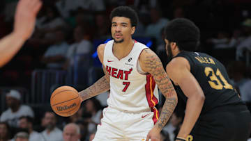 Apr 26, 2025; Miami, Florida, USA; Miami Heat center Kel'el Ware (7) dribbles the basketball as Cleveland Cavaliers center Jarrett Allen (31) defends in the third quarter during game three for the first round of the 2025 NBA Playoffs at Kaseya Center. Mandatory Credit: Sam Navarro-Imagn Images