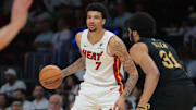 Miami Heat center Kel'el Ware (7) dribbles the basketball as Cleveland Cavaliers center Jarrett Allen (31) defends in the third quarter during game three for the first round of the 2025 NBA Playoffs at Kaseya Center.
