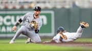 Apr 23, 2025; Minneapolis, Minnesota, USA; The throw to Chicago White Sox shortstop Jacob Amaya (8) is late as Minnesota Twins second base Luke Keaschall (15) slides safe into second base in the third inning at Target Field. Mandatory Credit: Matt Blewett-Imagn Images