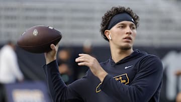 Sep 19, 2024; Boone, North Carolina, USA;  Appalachian State Mountaineers quarterback Joey Aguilar (4) throws a warmup pass before the game against the South Alabama Jaguars at Kidd Brewer Stadium. Mandatory Credit: Reinhold Matay-Imagn Images