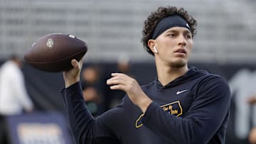 Sep 19, 2024; Boone, North Carolina, USA;  Appalachian State Mountaineers quarterback Joey Aguilar (4) throws a warmup pass before the game against the South Alabama Jaguars at Kidd Brewer Stadium. Mandatory Credit: Reinhold Matay-Imagn Images
