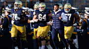 Notre Dame head coach Marcus Freeman takes the field with his players before a NCAA football game against Syracuse at Notre Dame Stadium on Saturday, Nov. 22, 2025, in South Bend.