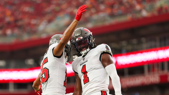 Aug 23, 2024; Tampa, Florida, USA; Tampa Bay Buccaneers running back Rachaad White (1) wide receiver Jalen McMillan (15) after scoring a touchdown against the Miami Dolphins in the first quarter during preseason at Raymond James Stadium. Mandatory Credit: Nathan Ray Seebeck-USA TODAY Sports