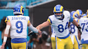 Nov 30, 2025; Charlotte, North Carolina, USA; Los Angeles Rams tight end Colby Parkinson (84) celebrates with Los Angeles Rams quarterback Matthew Stafford (9) during the fourth quarter against the Carolina Panthers at Bank of America Stadium. Mandatory Credit: Scott Kinser-Imagn Images