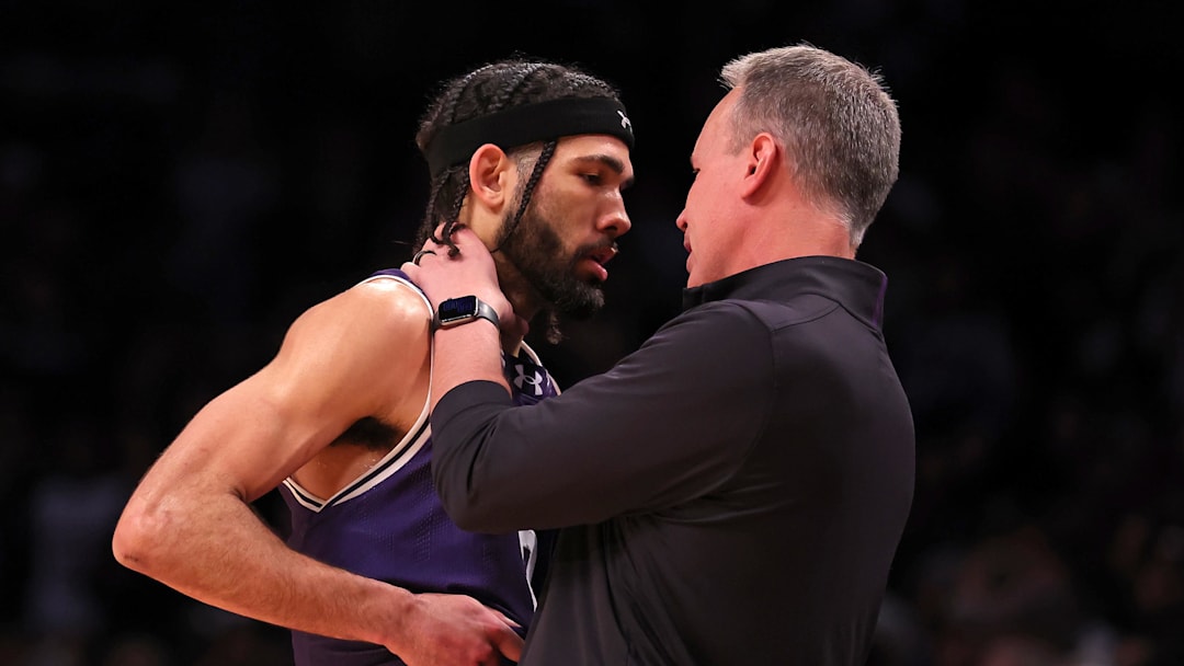 Mar 24, 2024; Brooklyn, NY, USA; Northwestern Wildcats head coach Chris Collins reacts with guard Boo Buie (0) in the second round of the 2024 NCAA Tournament at the Barclays Center. Mandatory Credit: Brad Penner-Imagn Images