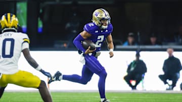 Oct 5, 2024; Seattle, Washington, USA; Washington Huskies quarterback Demond Williams Jr. (2) rushes against the Michigan Wolverines during the third quarter at Alaska Airlines Field at Husky Stadium. Mandatory Credit: Joe Nicholson-Imagn Images