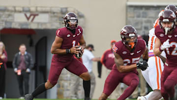 Nov 9, 2024; Blacksburg, Virginia, USA;  Virginia Tech Hokies quarterback Kyron Drones (1) looks to pass the ball against the Clemson Tigers during the second quarter at Lane Stadium. Mandatory Credit: Brian Bishop-Imagn Images