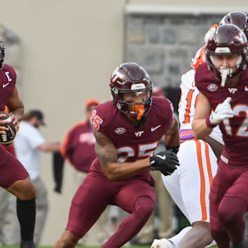 Nov 9, 2024; Blacksburg, Virginia, USA;  Virginia Tech Hokies quarterback Kyron Drones (1) looks to pass the ball against the Clemson Tigers during the second quarter at Lane Stadium. Mandatory Credit: Brian Bishop-Imagn Images