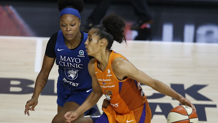 Sep 17, 2020; Palmetto, Florida, USA; Phoenix Mercury guard Skylar Diggins-Smith (4) drives past Minnesota Lynx guard Odyssey Sims (1left during the second half at the FELD entertainment complex. Mandatory Credit: Reinhold Matay-Imagn Images