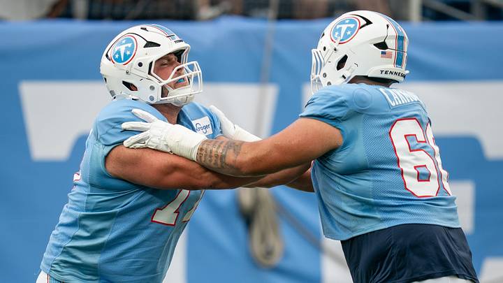 Tennessee Titans offensive lineman Peter Skoronski (77) and guard Fernando Carmona Jr. (66) run drills during the Blue and White Stadium Scrimmage at Nissan Stadium in Nashville, Tenn., Friday, Aug. 7, 2026.
