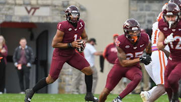 Nov 9, 2024; Blacksburg, Virginia, USA;  Virginia Tech Hokies quarterback Kyron Drones (1) looks to pass the ball against the Clemson Tigers during the second quarter at Lane Stadium. Mandatory Credit: Brian Bishop-Imagn Images