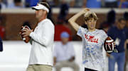 Oct 28, 2023; Oxford, Mississippi, USA; Mississippi Rebels head coach Lane Kiffin (left) and his son Knox Kiffin during warm ups prior to a game against the Vanderbilt Commodores at Vaught-Hemingway Stadium. Mandatory Credit: Petre Thomas-Imagn Images