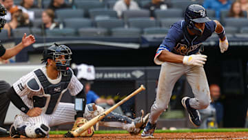 Bronx, New York, USA; Tampa Bay Rays center fielder Chandler Simpson (14) hits an infield single during the fifth inning against the New York Yankees at Yankee Stadium.