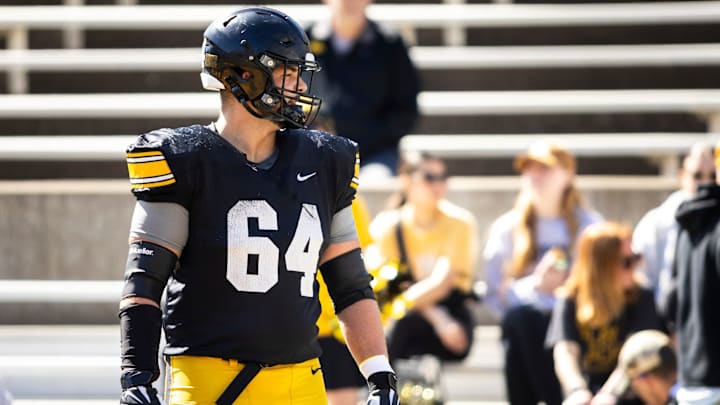 Apr 26, 2025; Iowa City, IA, USA; Iowa offensive lineman Leighton Jones (64) warms up during a spring NCAA football open practice at Kinnick Stadium. Mandatory Credit: Joseph Cress/For the Register