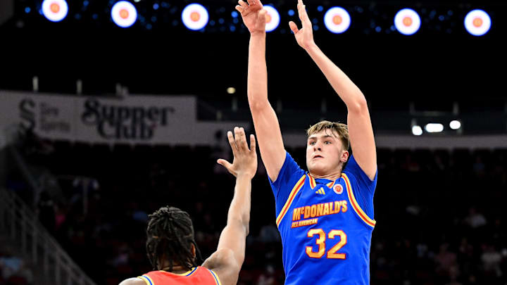 Apr 2, 2024; Houston, TX, USA; McDonald's All American East forward Cooper Flagg (32) shoots a three point basket over McDonald's All American West forward Donavan Freeman (10) during the first half at Toyota Center. Mandatory Credit: Maria Lysaker-Imagn Images