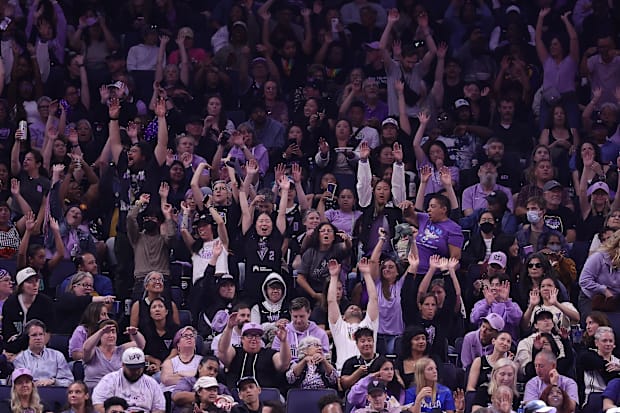 Golden State Valkyries fans do the wave during a timeout.