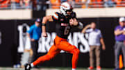 Nov 15, 2025; Stillwater, Oklahoma, USA; Oklahoma State Cowboys quarterback Zane Flores (6) runs the ball during the first half against the Kansas State Wildcats at Boone Pickens Stadium. Mandatory Credit: William Purnell-Imagn Images