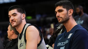 Grizzlies' Zach Edey (14) and Santi Aldama (7) sit on the bench during open practice at the FedExForum on October 4, 2025, in Memphis, Tenn.