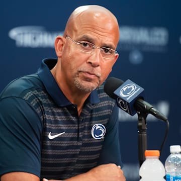 Penn State coach James Franklin takes a question during a press conference at the team's 2024 football media day in Beaver Stadium. 