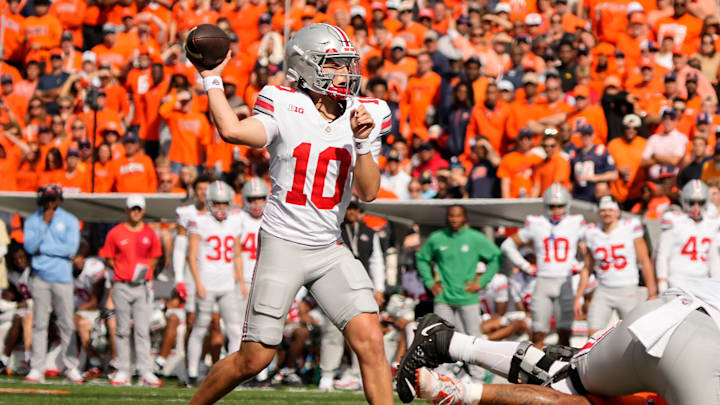 Ohio State Buckeyes quarterback Julian Sayin (10) throws during the second half of the NCAA football game against the Illinois Fighting Illini at Gies Memorial Stadium in Champaign on Oct. 11, 2025. Ohio State won 34-16.