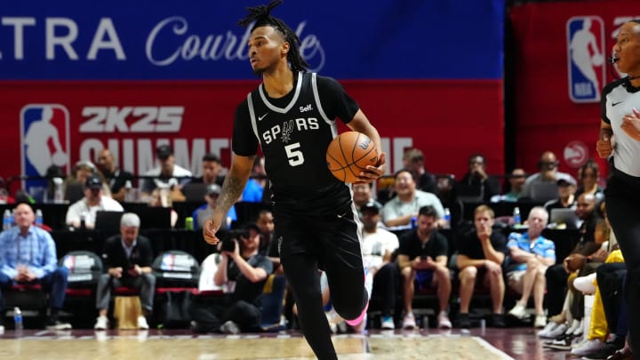 Jul 13, 2024; Las Vegas, NV, USA; San Antonio Spurs guard Stephon Castle (5) dribbles against the Portland Trail Blazers during the first quarter at Thomas & Mack Center. Mandatory Credit: Stephen R. Sylvanie-USA TODAY Sports