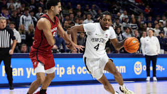 Penn State Nittany Lions guard Kayden Mingo (4) dribbles the ball defended by Harvard Crimson guard Tey Barbour (8) during the first half at Bryce Jordan Center. 