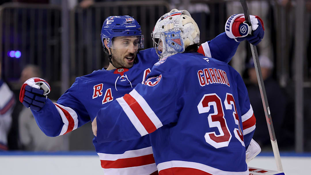 Mar 27, 2026; New York, New York, USA; New York Rangers goaltender Dylan Garand (33) is congratulated by center Vincent Trocheck (16) after his first career NHL win against the Chicago Blackhawks at Madison Square Garden. Mandatory Credit: Brad Penner-Imagn Images