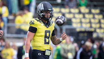 Oregon quarterback Dillon Gabriel twirls the ball as the No. 1 Oregon Ducks host the No. 21 Illinois Fighting Illini Saturday, Oct. 26, 2024 at Autzen Stadium in Eugene, Ore.