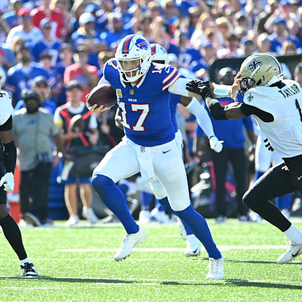 Bills quarterback Josh Allen (17) runs for a gain against the Saints cornerback in Week 4.