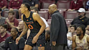 Mar 9, 2024; Tallahassee, Florida, USA; Miami Hurricanes guard Matthew Cleveland (0) and Florida State Seminoles head coach Leonard Hamilton are seen during the first half at Donald L. Tucker Center. Mandatory Credit: Melina Myers-Imagn Images