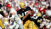 Jan 15, 1987; Los Angeles, CA; USA; Green Bay Packers quarterback (15) Bart Starr in action during Super Bowl I at the Los Angeles Coliseum against the Kansas City Chiefs. The Packers defeated the Chiefs 35-10 to win the first Super Bowl Title. Starr was 16-23 for 250 yards and 2 touchdowns and was named the games most valuable player.  