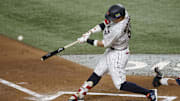 Mar 21, 2023; Miami, Florida, USA; Japan third baseman Munetaka Murakami (55) hits a home run against the USA in the second inning at LoanDepot Park. Mandatory Credit: Rhona Wise-Imagn Images