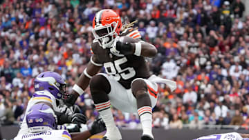 Oct 5, 2025; Tottenham, United Kingdom; Cleveland Browns tight end David Njoku (85) leaps over Minnesota Vikings linebacker Ivan Pace Jr. (0) during the third quarter of an NFL International Series game at Tottenham Hotspur Stadium. Mandatory Credit: Kirby Lee-Imagn Images