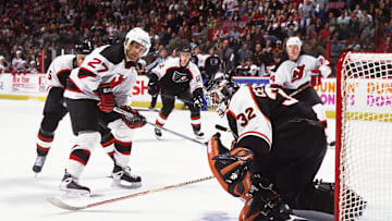 Unknown Date, 2001; East Rutherford, NJ, USA; FILE PHOTO; New Jersey Devils defensemen Scott Niedermayer (27) and Turner Stevenson (24) in action against Philadelphia Flyers goalie Roman Cechmanek (32), Kim Johnsson (5) and Simon Gagne (12) at Continental Airlines Arena. Mandatory Credit: Lou Capozzola-USA TODAY NETWORK
