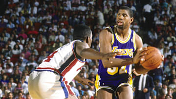 Jun 1988; Detroit, MI, USA; FILE PHOTO; Los Angeles Lakers guard Magic Johnson (32) is defended by Detroit Pistons guard Joe Dumars (4) during the 1988 NBA Finals at the Silverdome. Mandatory Credit: MPS-Imagn Images