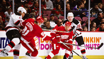 Jan 28, 2003; East Rutherford, NJ, USA; FILE PHOTO; Detroit Red Wings center Sergei Fedorov (91) and Igor Larionov (8) in action against New Jersey Devils defensemen Scott Stevens (4) and Sergei Brylin (18) at Continental Airlines Arena. Mandatory Credit: Lou Capozzola-USA TODAY NETWORK