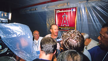 Jun 29, 2002; Anaheim, CA, USA; FILE PHOTO; Anaheim Angels pitcher Troy Percival (center) talks with media after clinching the 2002 American League Division Series. 